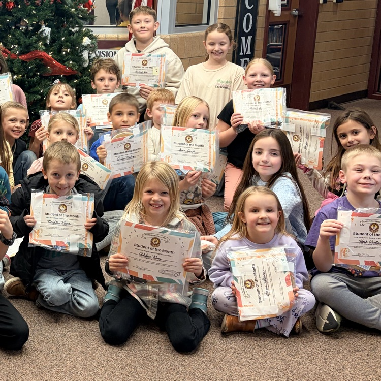 a group of students holding certificates 