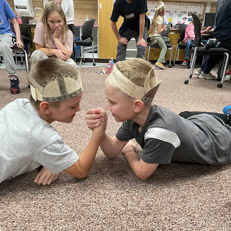 students arm wrestling