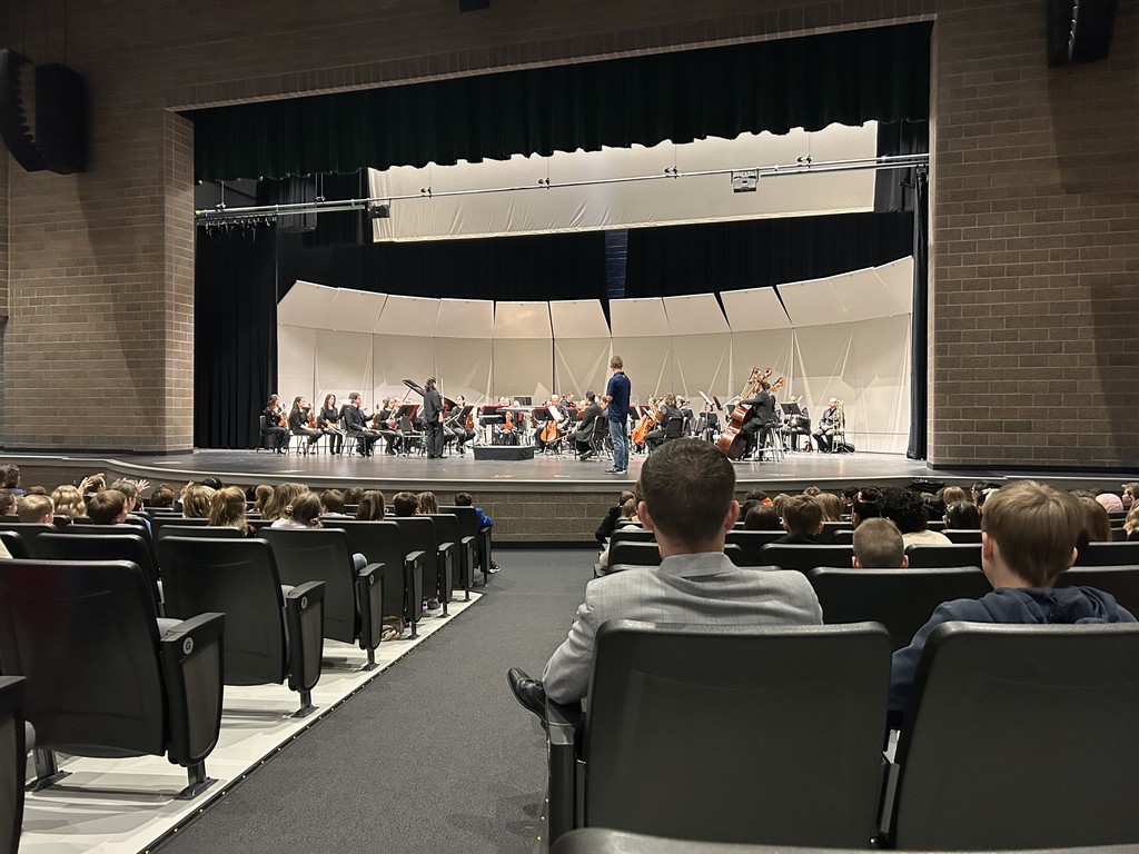 a stage with performers on it