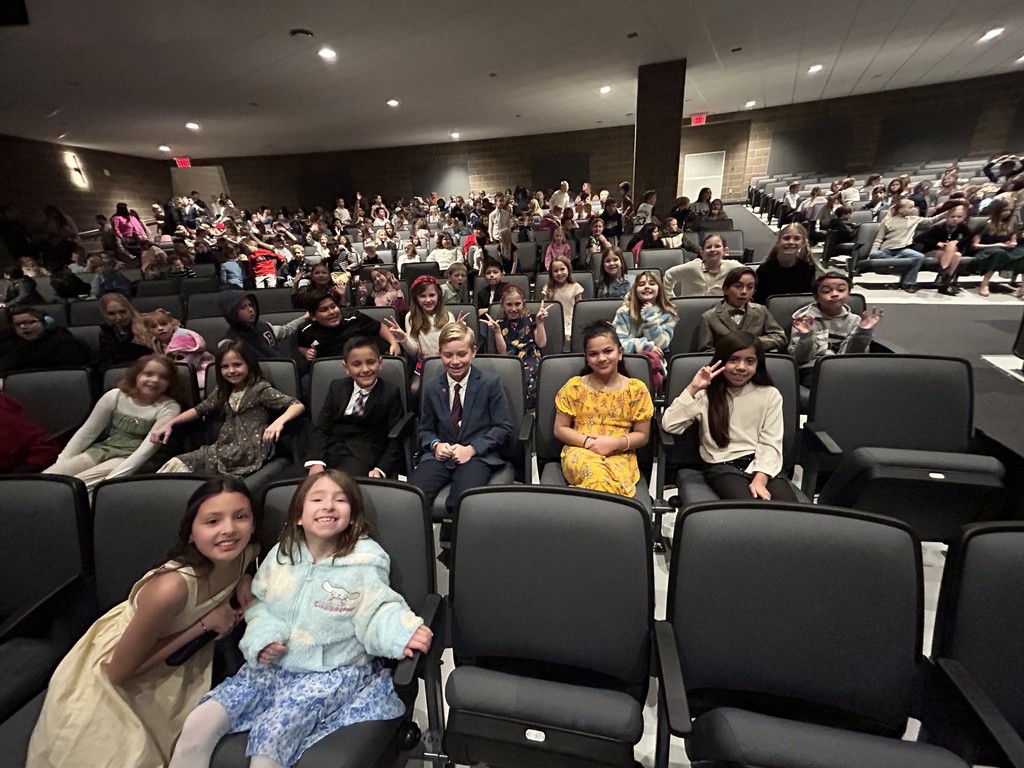 students smiling at the symphony
