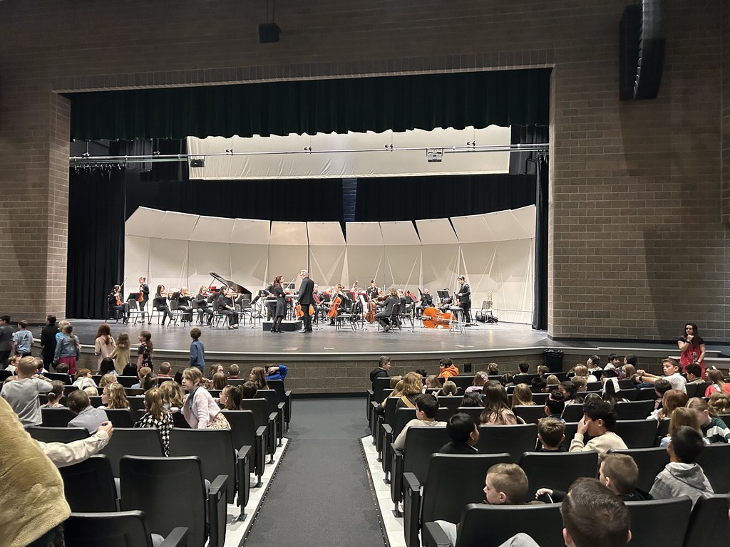 a stage with performers on it