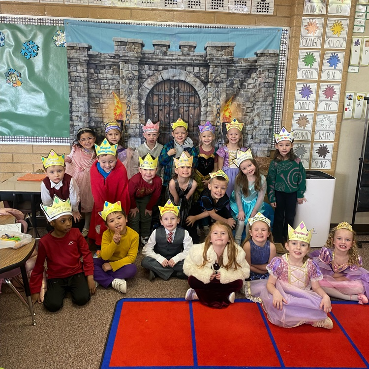 a class of kids with crowns on
