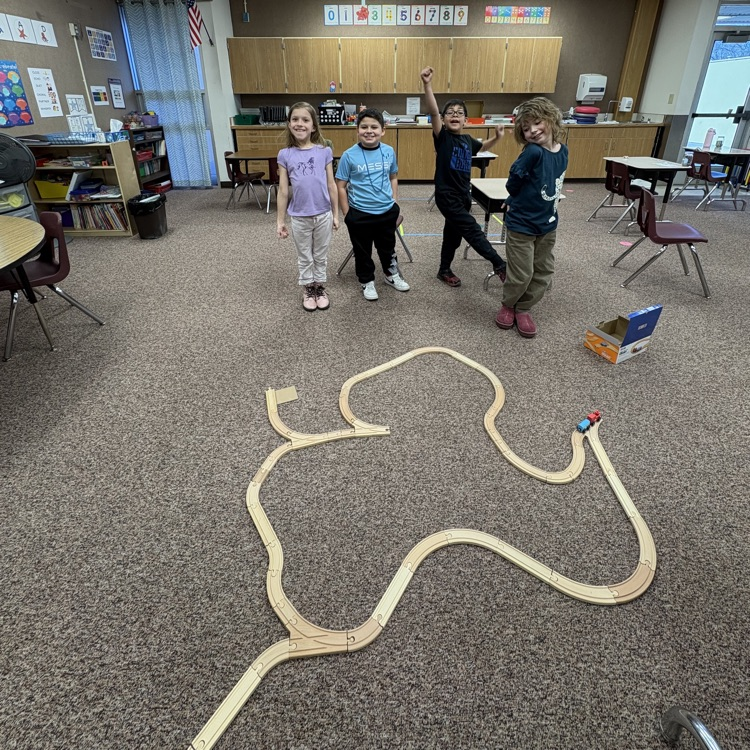 students building a train track depicting the western expansion 