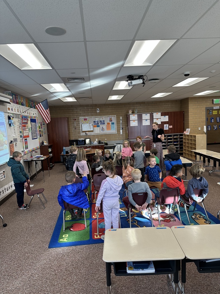 students learning from their teacher