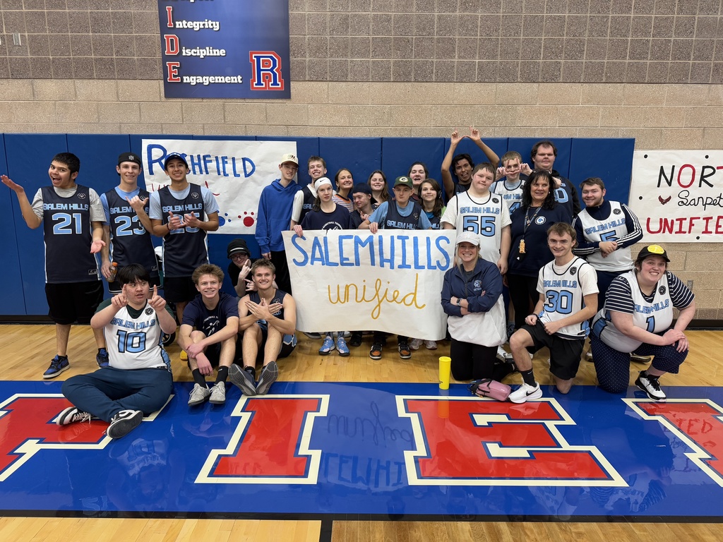 Unified Basketball full group holding a sign 