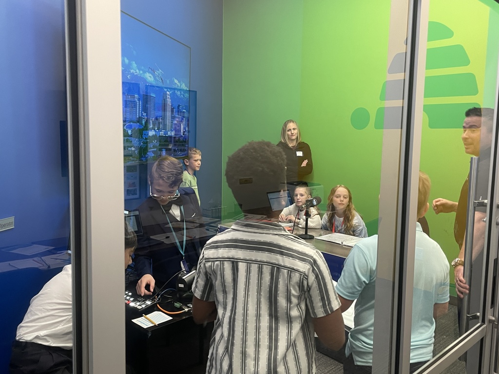 students working at a news station