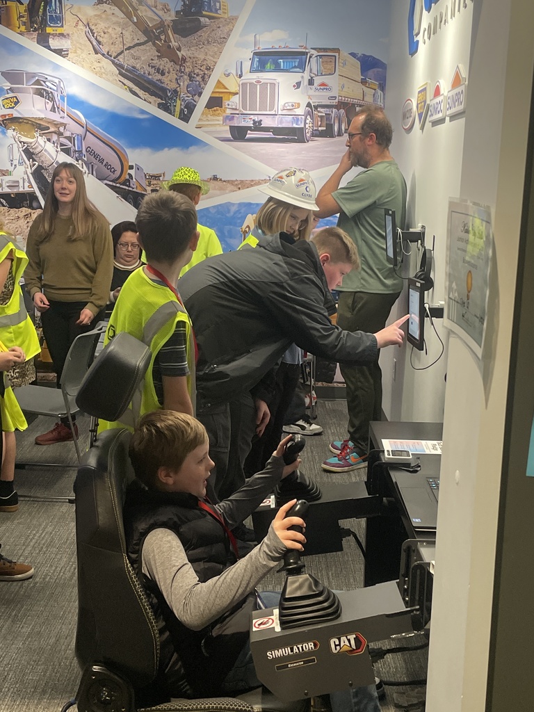 Students on a silulator digging