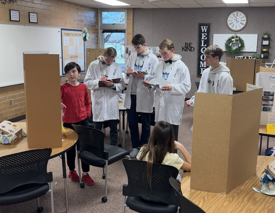 science students helping with elementary science fair