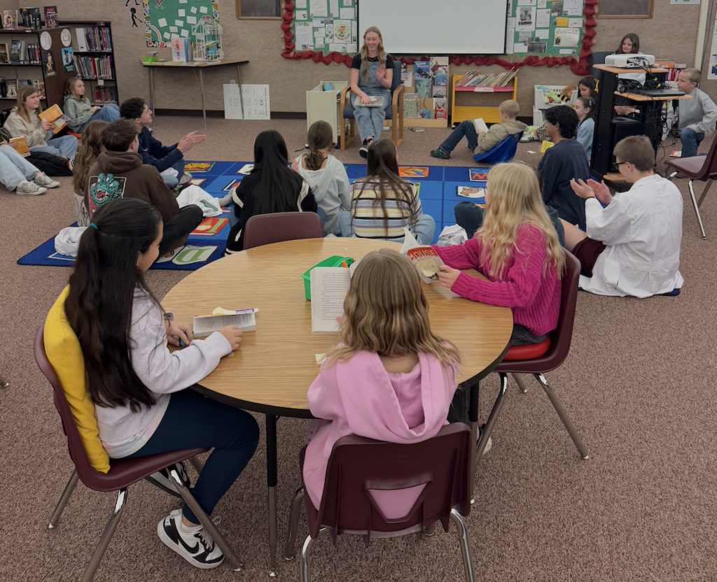 Science students helping with elementary science fair