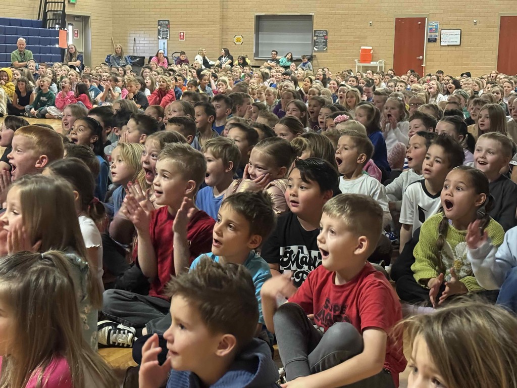 Students in awe of what they are seeing at the magic show assembly.