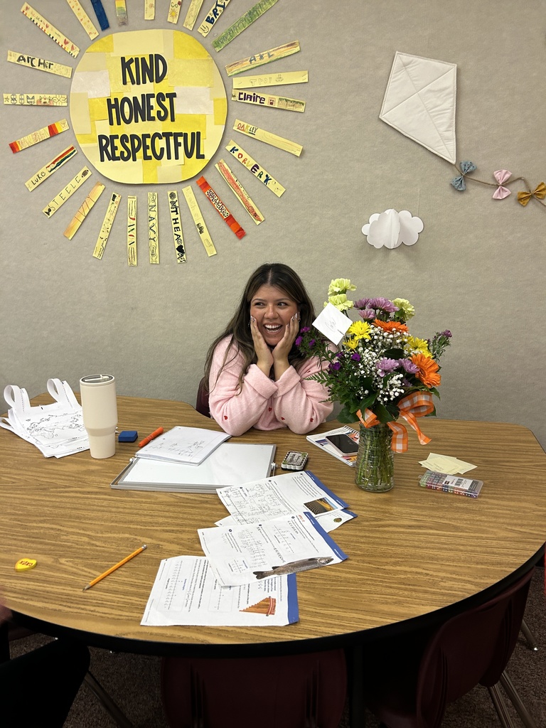 Carla Vela with flowers.