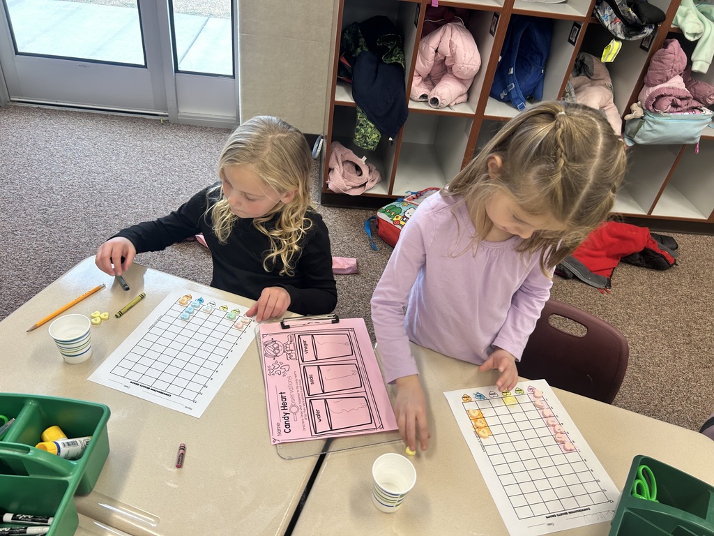 kindergartener working on their desk