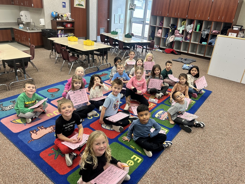 kindergarteners sitting on the rug