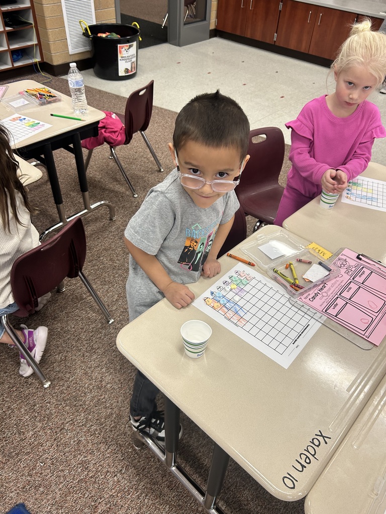 kindergartener working on their desk
