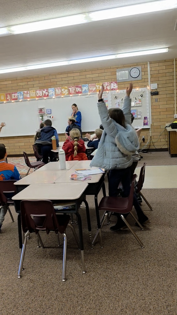 hearing the announcement of being recognized as teacher of the year and students celebrating