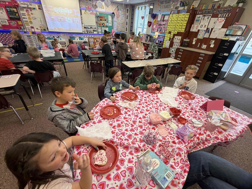Students eating cookies.