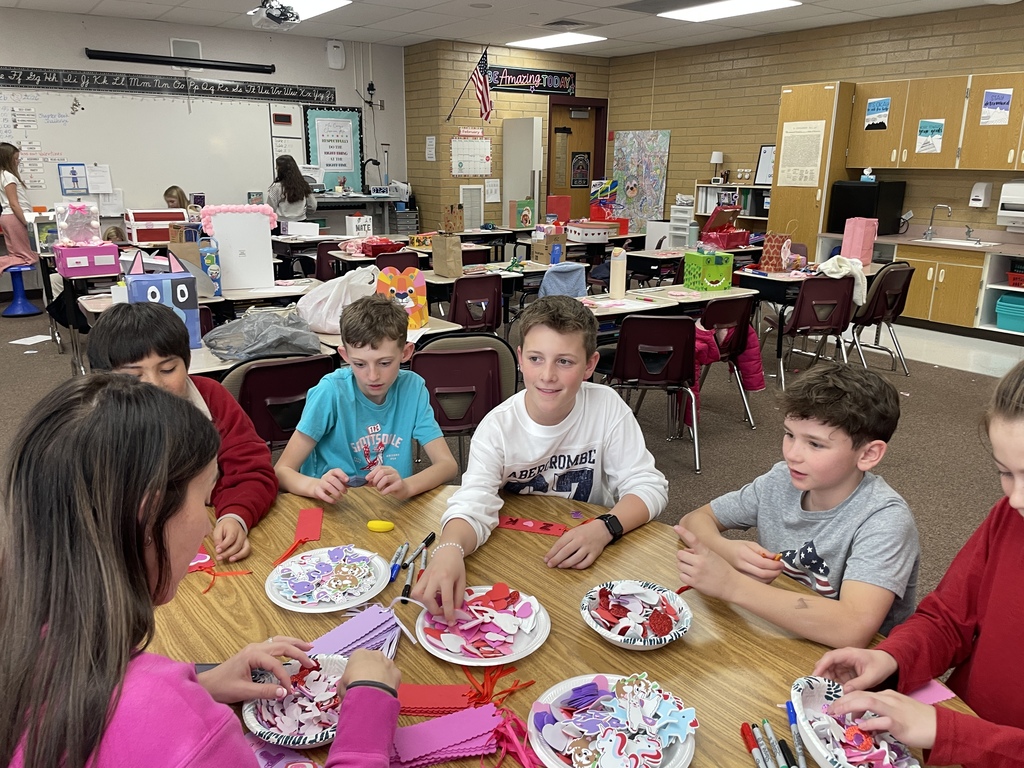 Students making Valentine crafts