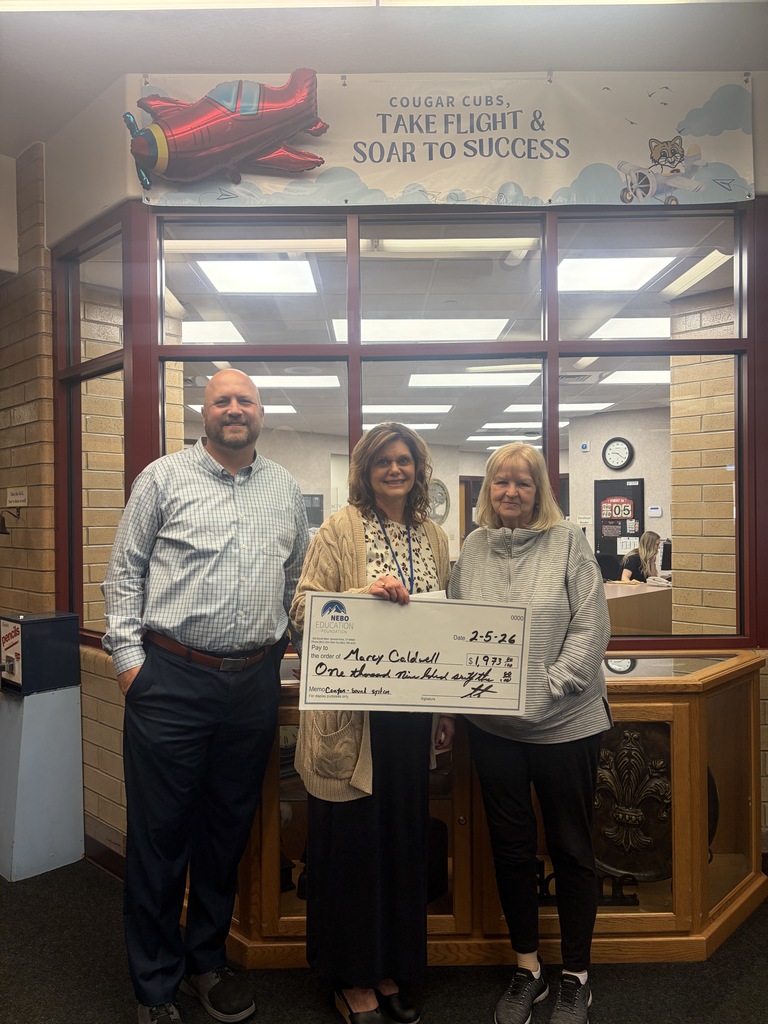 Mrs. Caldwell getting an award from the Nebo Foundation