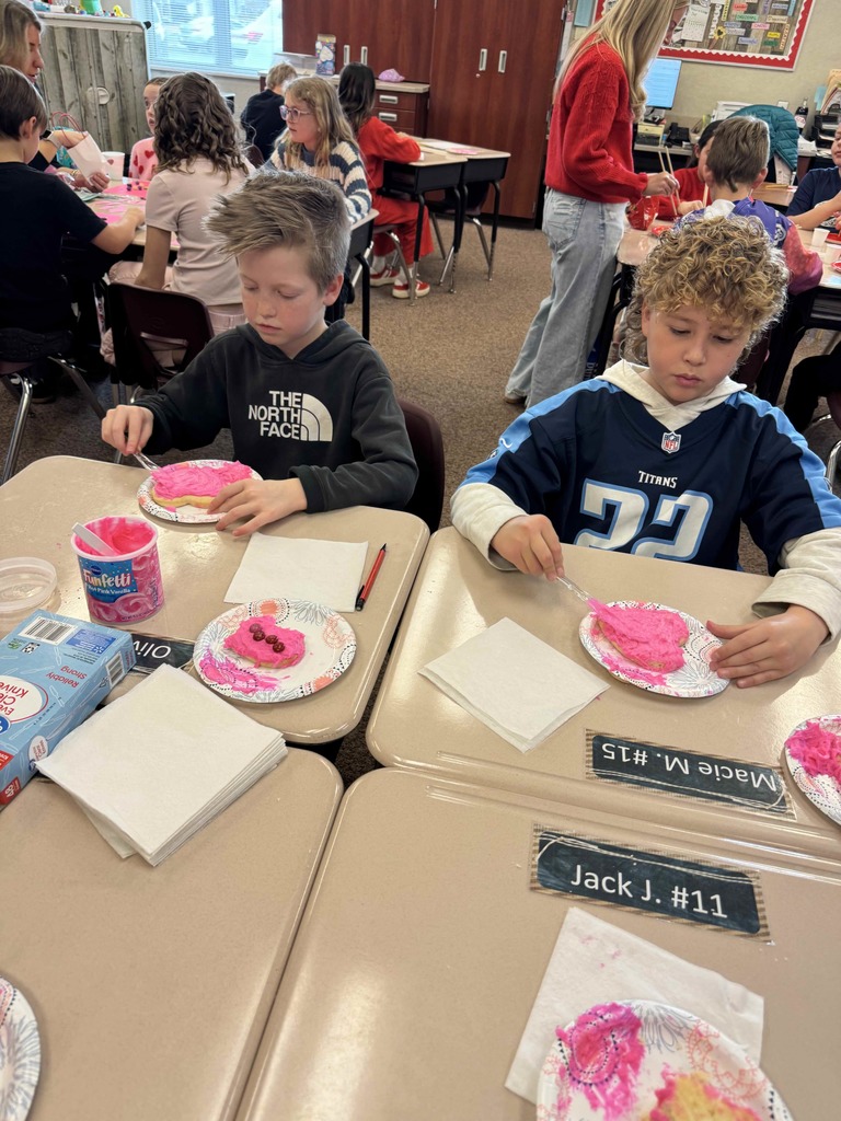 Students decorating cookies.