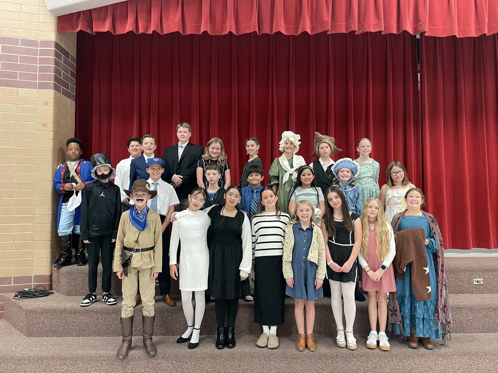 group of 5th grade students dressed up as presidents and presidents wives