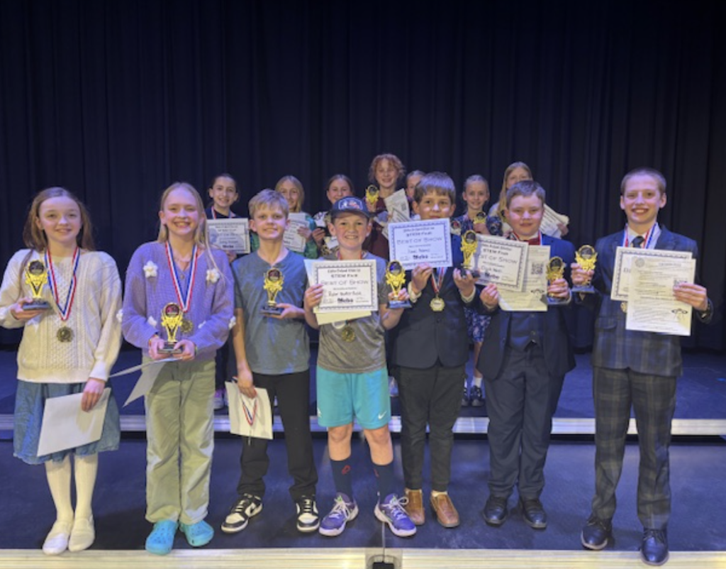 Students holding their certificates.