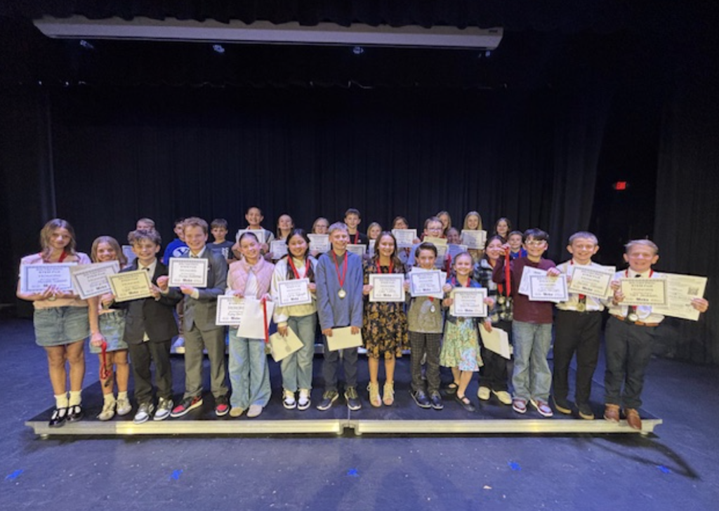 Students holding their certificates.