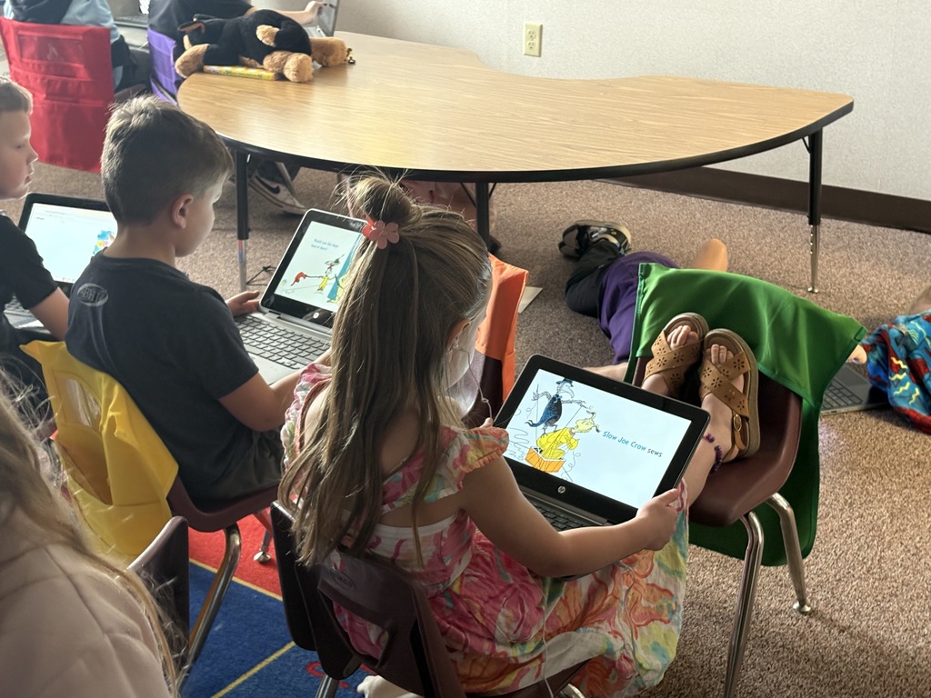 Students reading Dr. Seuss books