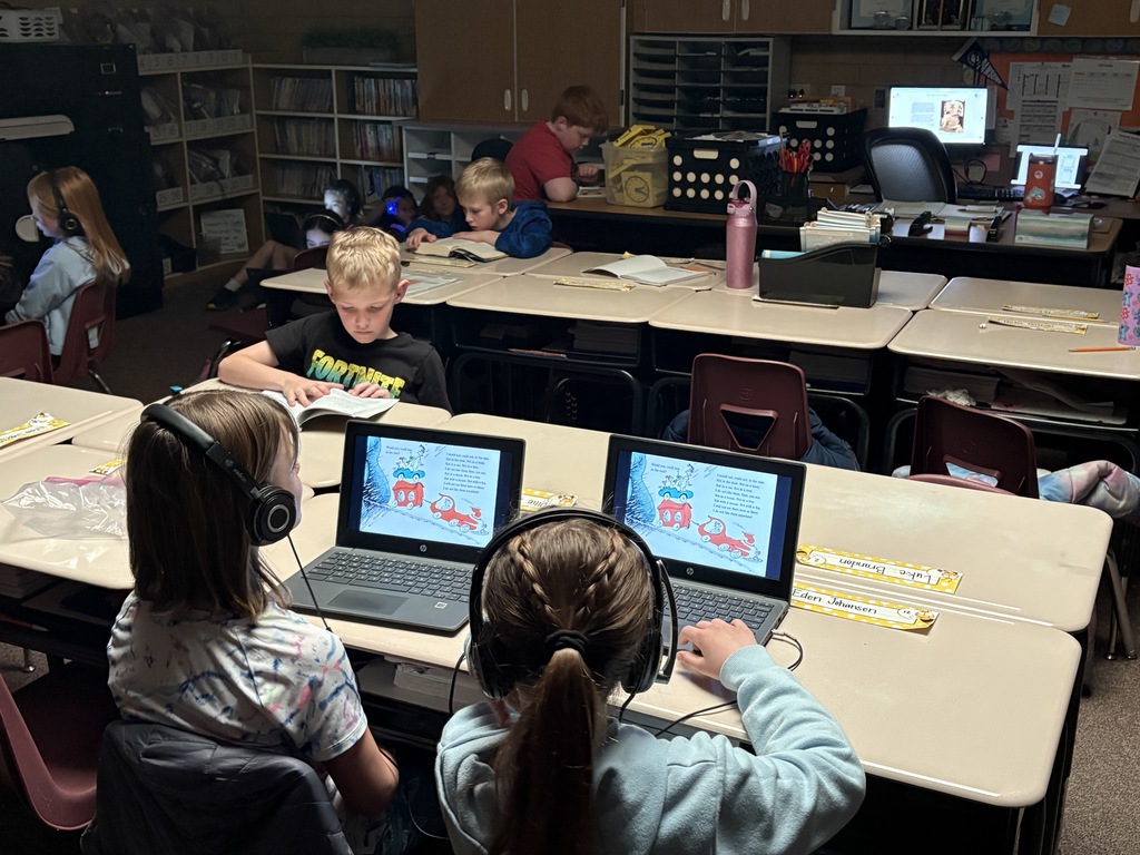 Students reading Dr. Seuss books