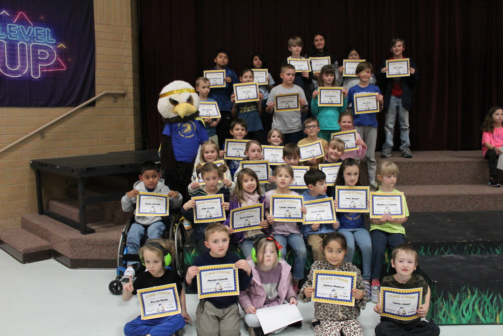 January Stand Strong Students holding their certificates for Stand Strong Students of the month