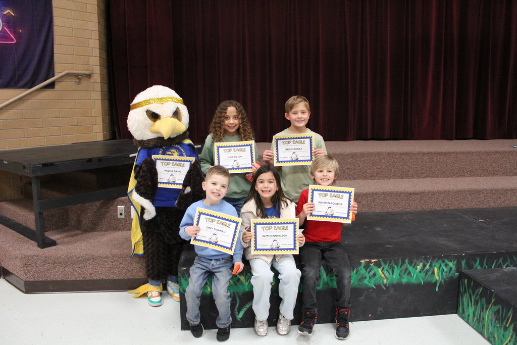 February Top Eagles pose for a picture with their certificates and ACE the Eagle.