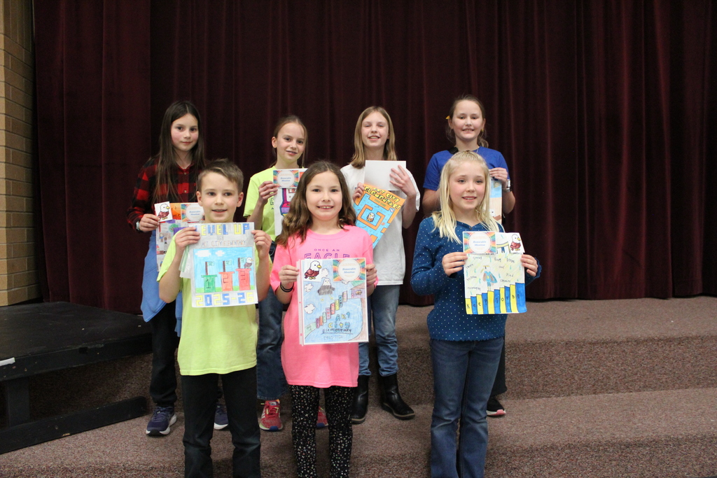 Seven students who drew pictures for the yearbook cover