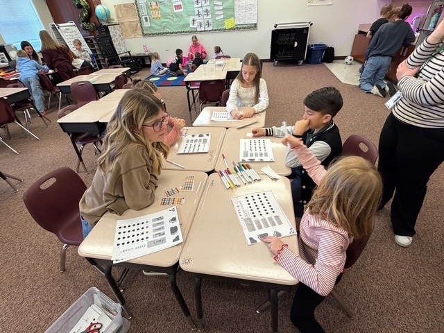 Students playing a game with a UVU nursing student.