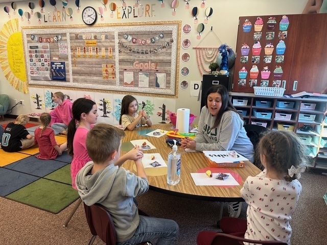 Students playing a game with a UVU nursing student.