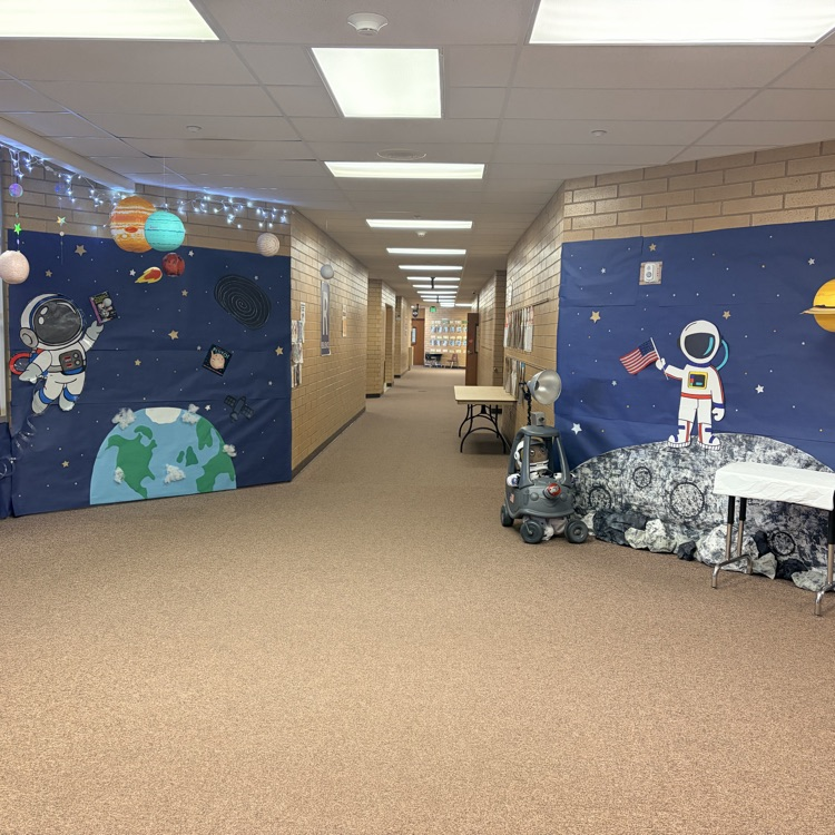 two walls decorated in space and astronauts 