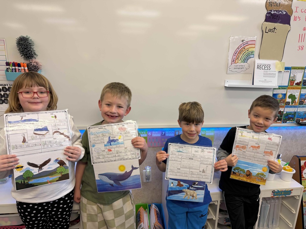 Students showing their finished work.