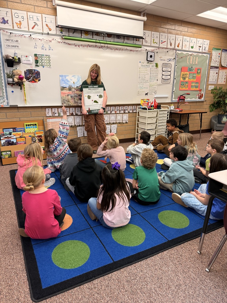 Students listening to a lesson by a Red Butte Garden employee.