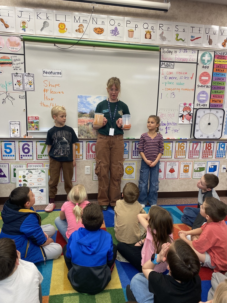 Students helping a Red Butte Garden employee with a demonstration.