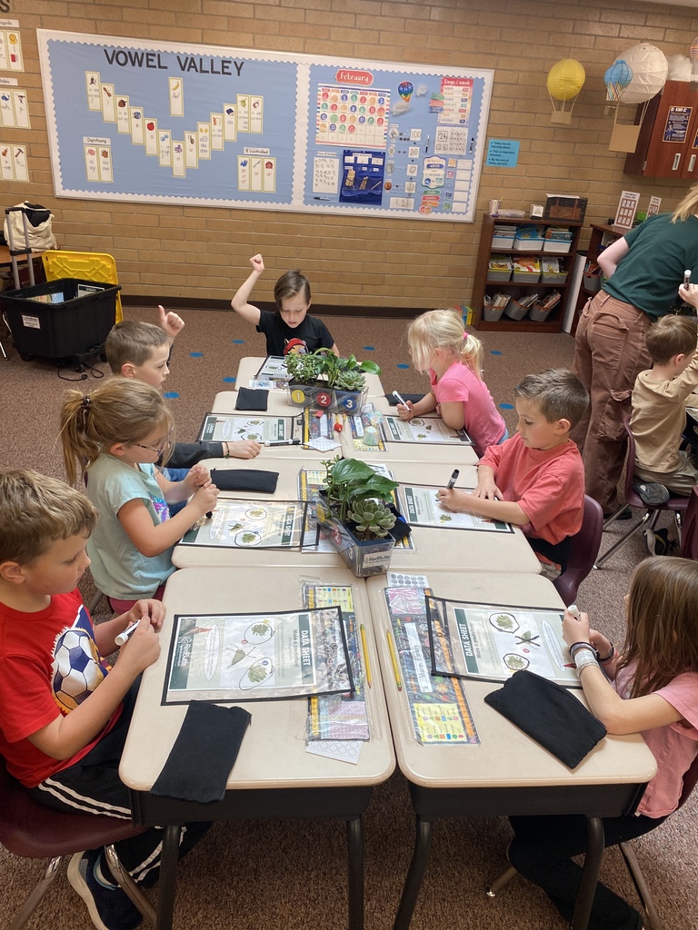Students listening to a Red Butte Garden employee.