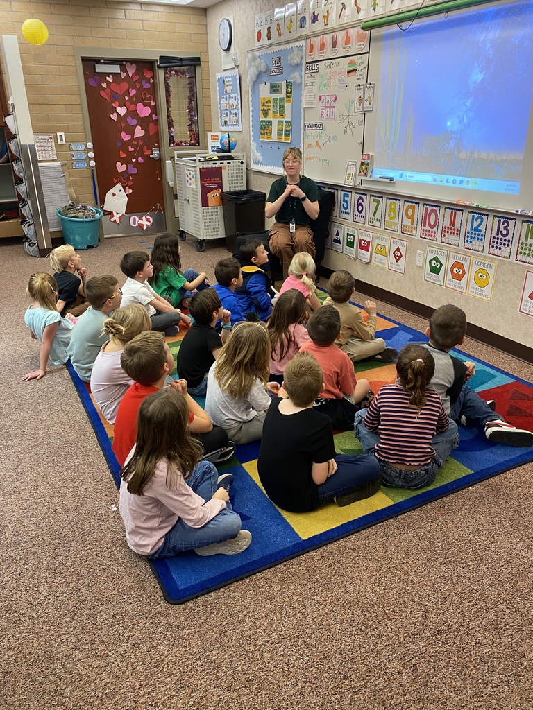 Students listening to a Red Butte Garden employee.
