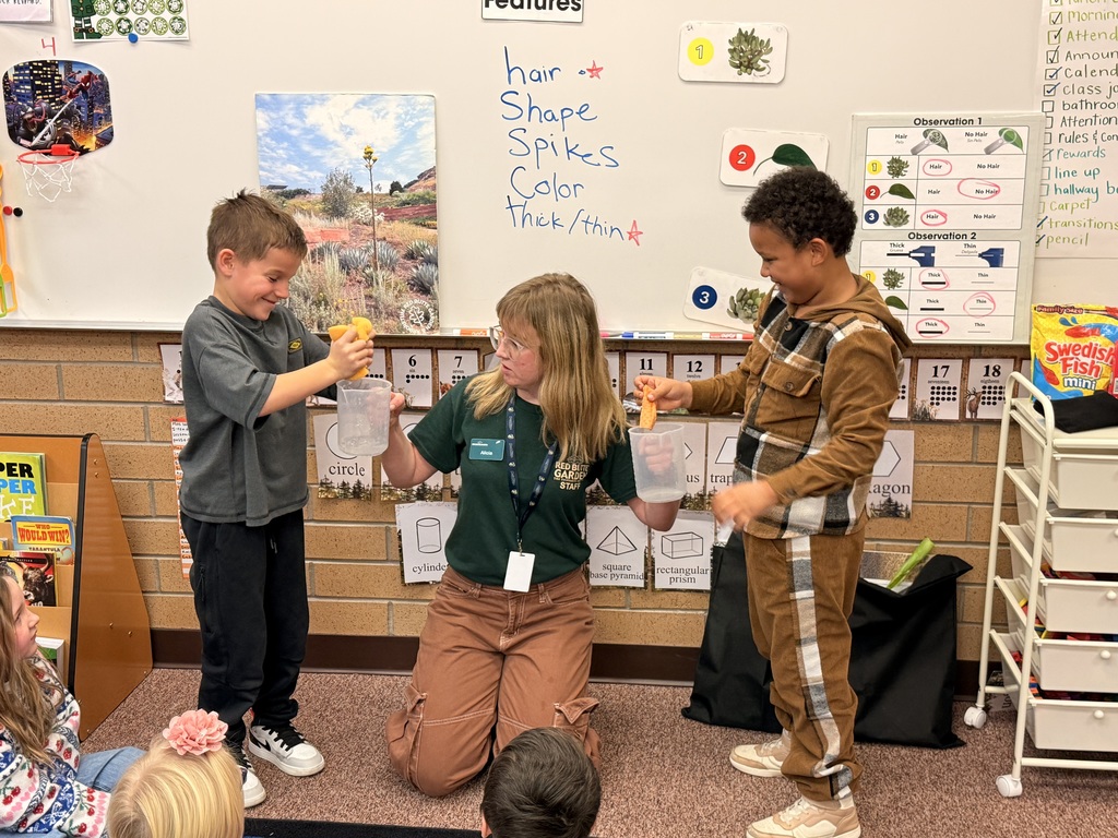 Students helping a Red Butte Garden employee with a demonstration.
