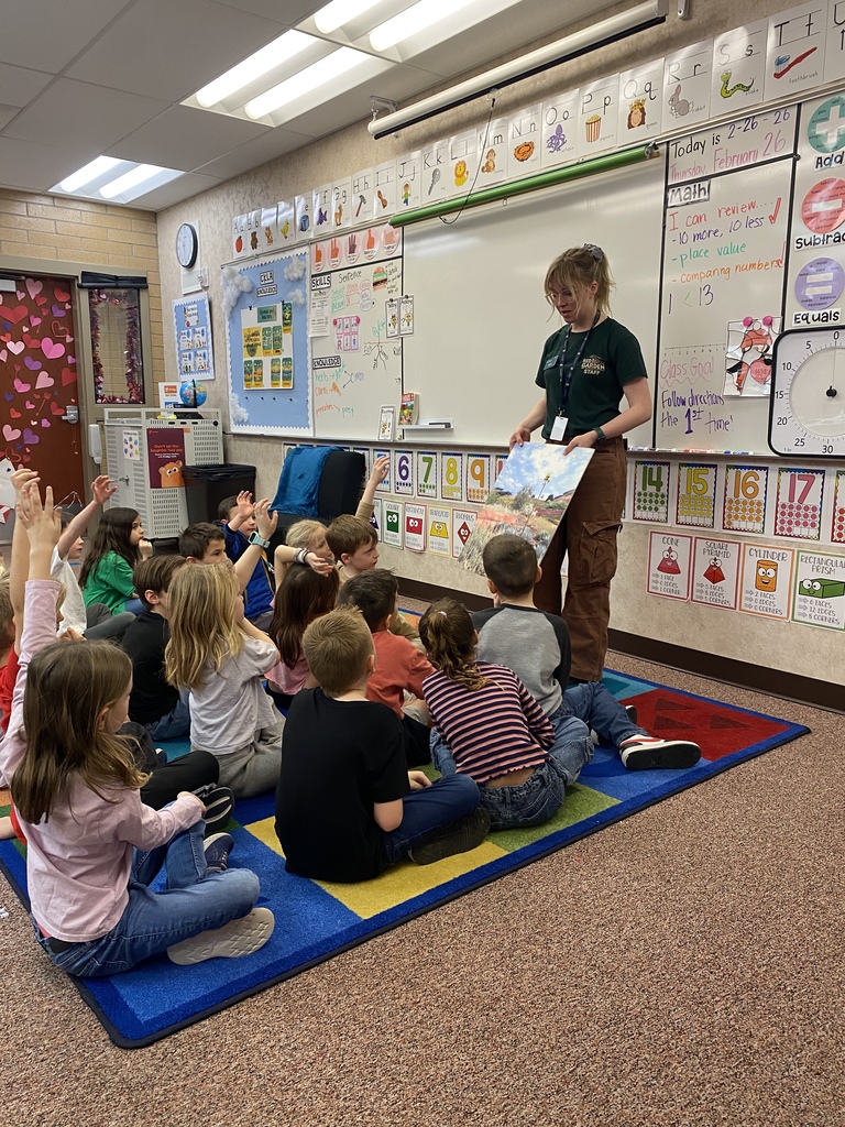 Students listening to a Red Butte Garden employee.