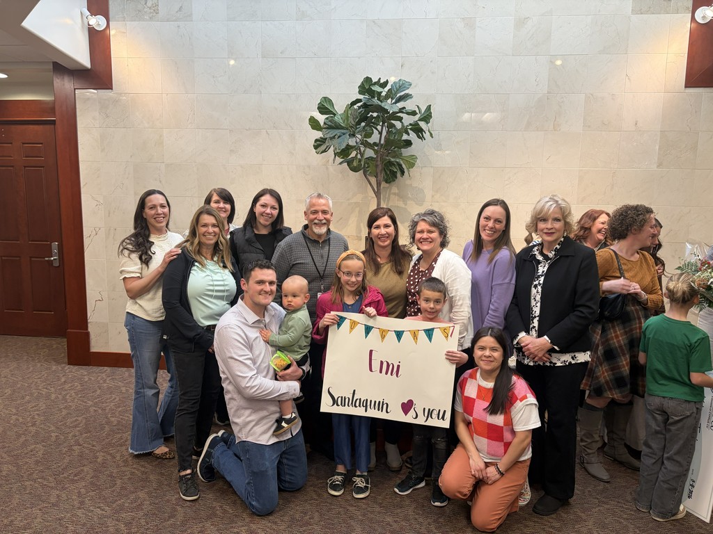 emi being recognized at the district board meeting as classified employee of the year