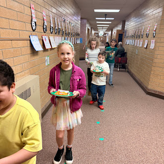 Students walking with treats