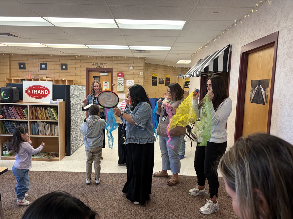 Mrs. Robbins and her friends spreading sunshine in Mrs. Hirst class.