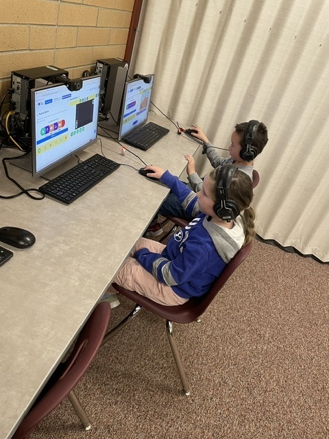 students coding in computers
