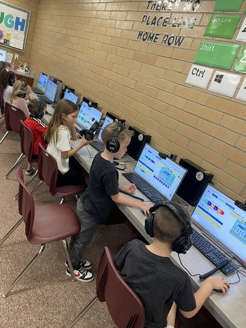 students coding in computers