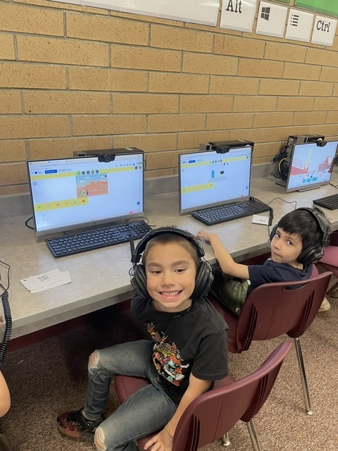 students coding in computers