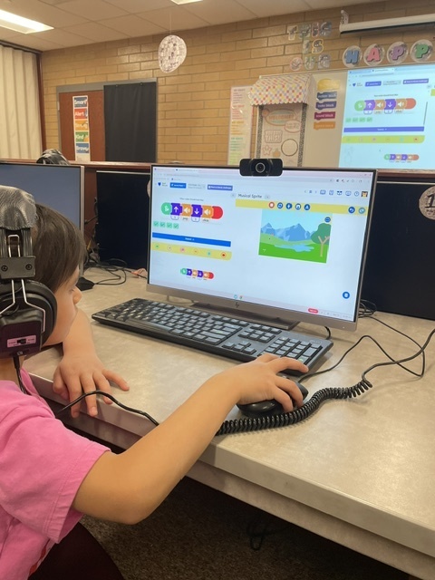 students coding in computers