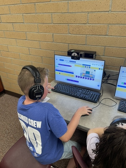 students coding in computers