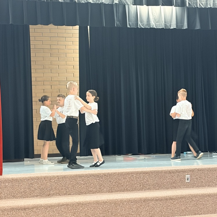 3 pairs of students dancing together 